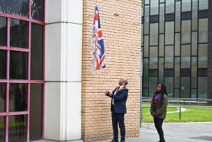 Photo showing Mayor of Basildon raising the Armed Forces flag