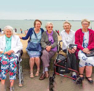 Decorative image showing Basildon Heroes - The Basildon Contact the Elderly team with clients at a day at the seaside